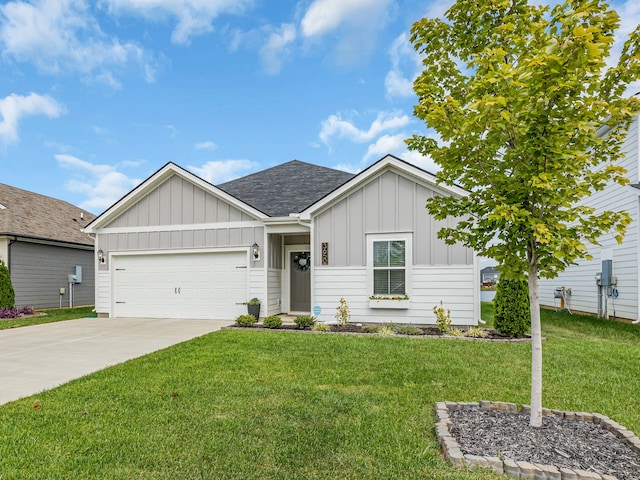 view of front of property featuring a garage and a front lawn