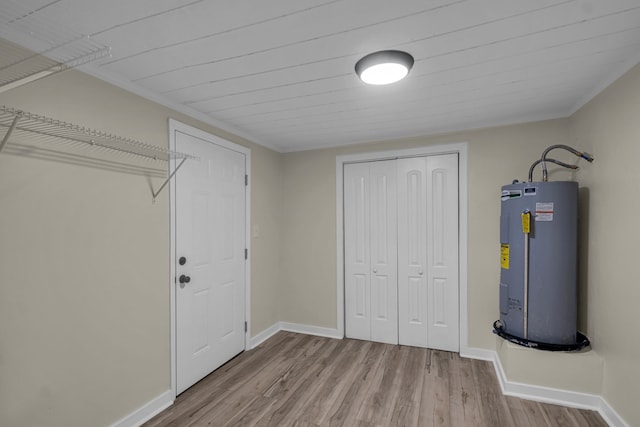 interior space featuring light hardwood / wood-style floors and electric water heater