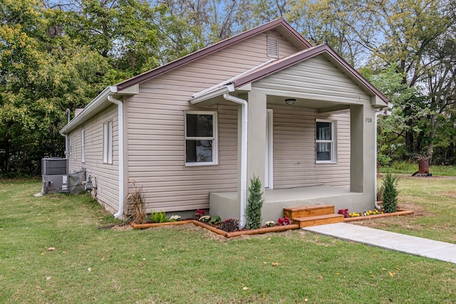 bungalow-style home with a front lawn