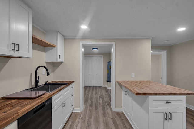 kitchen featuring sink, light wood-type flooring, dishwasher, butcher block countertops, and white cabinets