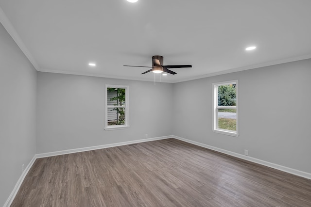 spare room featuring ornamental molding, wood-type flooring, and ceiling fan