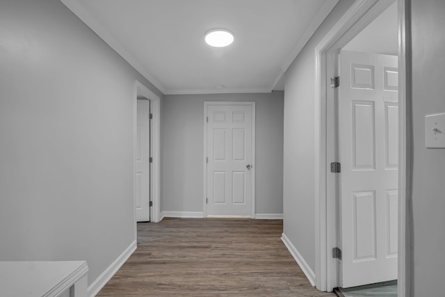 hallway with hardwood / wood-style flooring