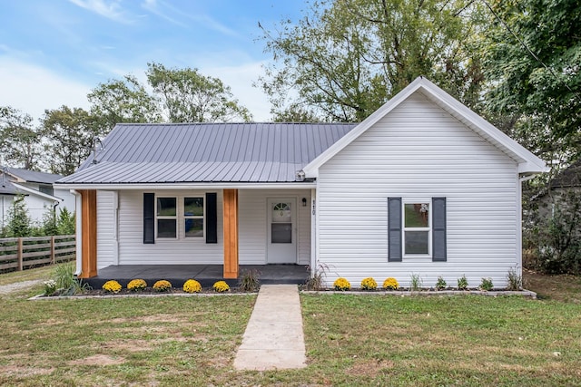 single story home featuring a front yard and covered porch