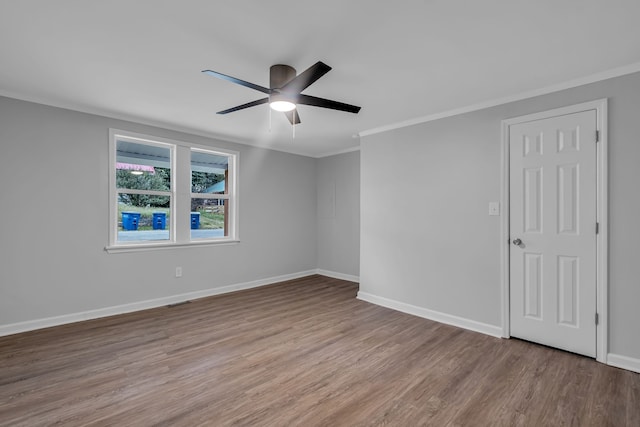 unfurnished room with crown molding, light hardwood / wood-style floors, and ceiling fan