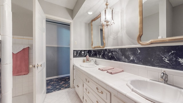 bathroom with vanity and tile patterned flooring