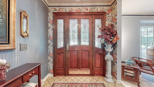 foyer entrance featuring ornamental molding