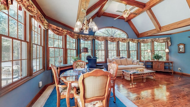 dining room featuring beam ceiling, hardwood / wood-style flooring, high vaulted ceiling, and ceiling fan with notable chandelier