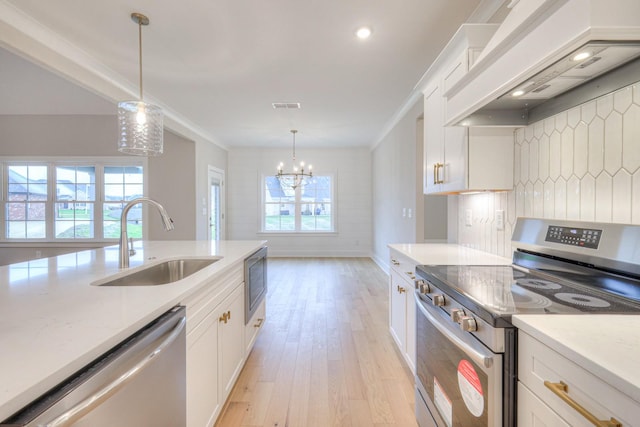 kitchen featuring stainless steel appliances, white cabinetry, sink, and custom range hood