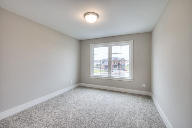 spare room featuring carpet