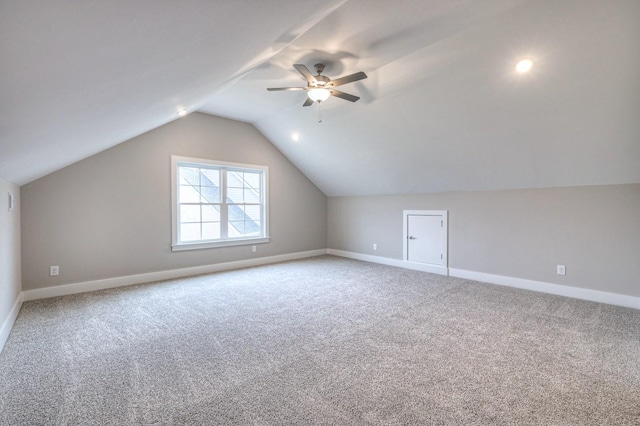 bonus room featuring lofted ceiling, ceiling fan, and carpet