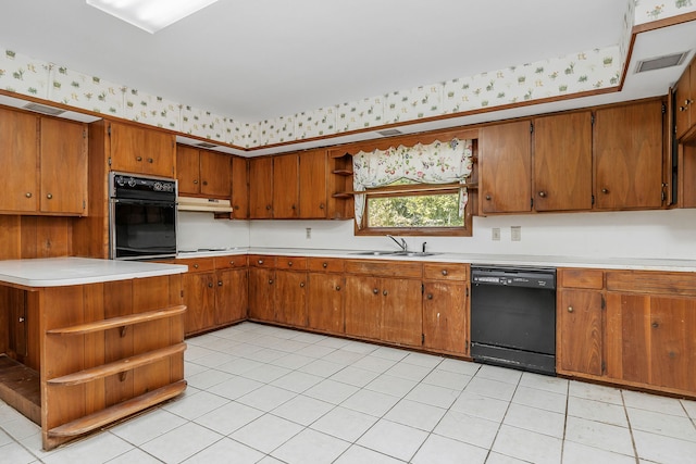 kitchen featuring stovetop, black dishwasher, sink, and light tile patterned floors