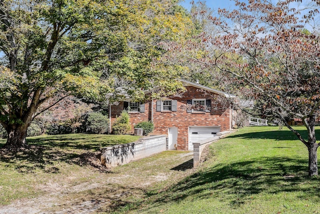 exterior space with a front yard and a garage