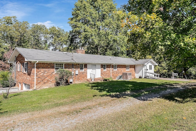 ranch-style home with a front lawn