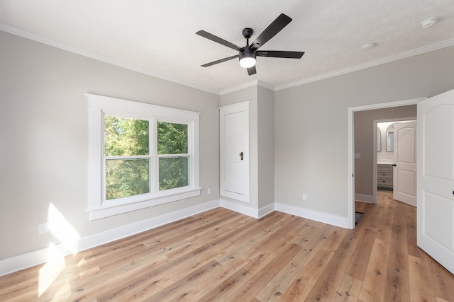 unfurnished bedroom with light hardwood / wood-style flooring, ornamental molding, and ceiling fan