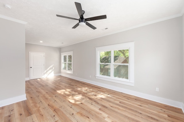 spare room with a textured ceiling, light hardwood / wood-style floors, and ceiling fan