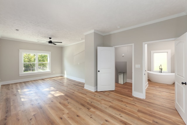 unfurnished bedroom with ornamental molding, a textured ceiling, light hardwood / wood-style floors, and ceiling fan