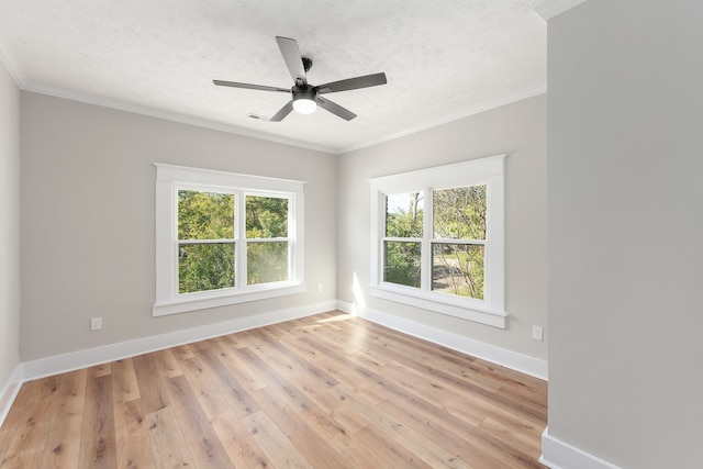 empty room with crown molding, a textured ceiling, light wood-type flooring, and ceiling fan