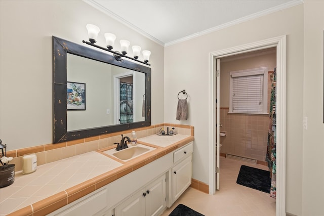 bathroom featuring vanity, crown molding, a shower with shower curtain, and tile patterned flooring