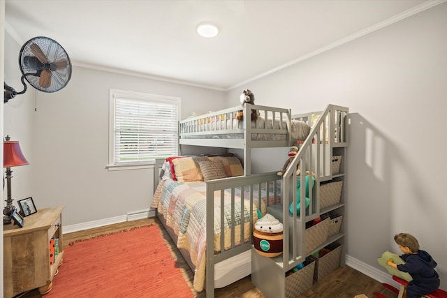 bedroom featuring crown molding and hardwood / wood-style flooring