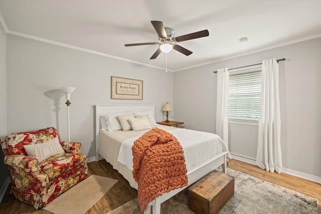 bedroom with crown molding, dark wood-type flooring, and ceiling fan