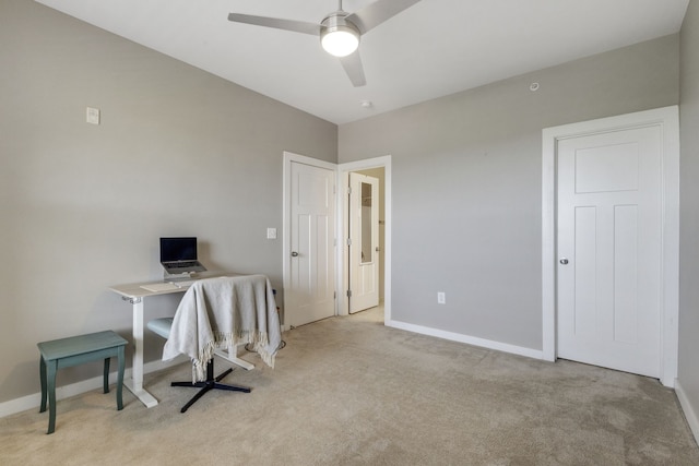 carpeted home office with ceiling fan