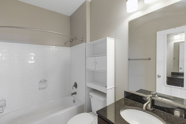 full bathroom with vanity, toilet, and tiled shower / bath combo