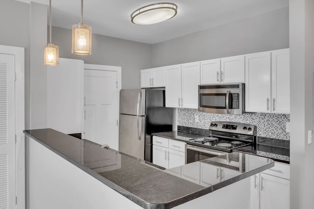 kitchen featuring white cabinetry, hanging light fixtures, tasteful backsplash, kitchen peninsula, and appliances with stainless steel finishes