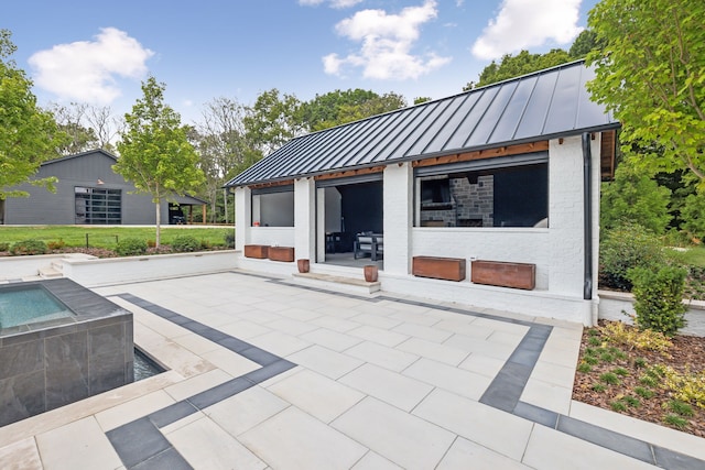 rear view of property with a patio