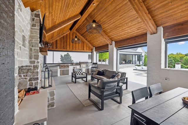 view of patio with exterior kitchen, an outdoor hangout area, and ceiling fan