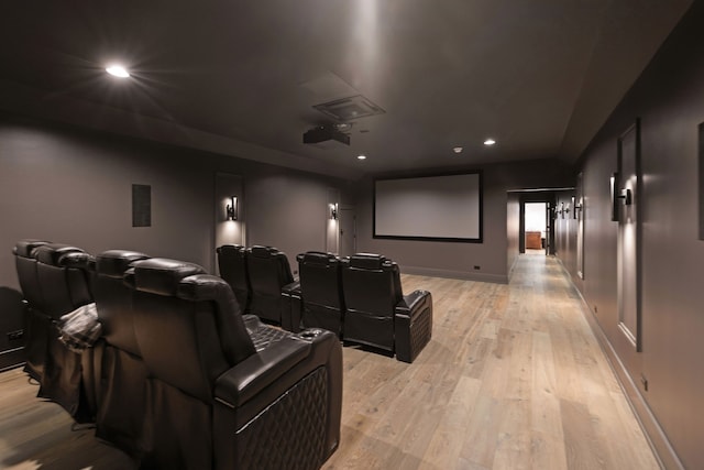 home theater room featuring light wood-type flooring