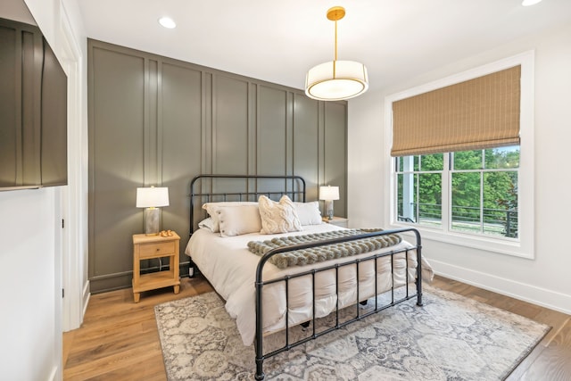 bedroom with light wood-type flooring