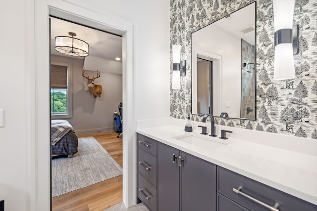 bathroom with vanity, curtained shower, and hardwood / wood-style flooring