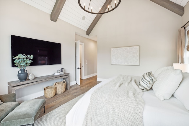 bedroom with hardwood / wood-style floors, beamed ceiling, wooden ceiling, high vaulted ceiling, and an inviting chandelier