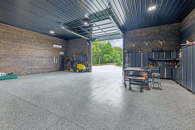 garage featuring wooden walls