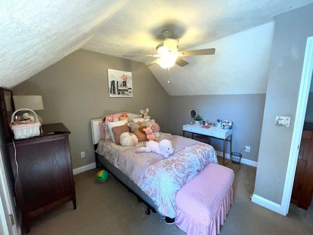 bedroom with carpet, vaulted ceiling, ceiling fan, and a textured ceiling