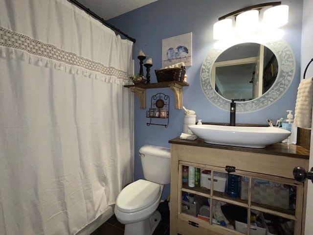 bathroom with a shower with curtain, vanity, and toilet