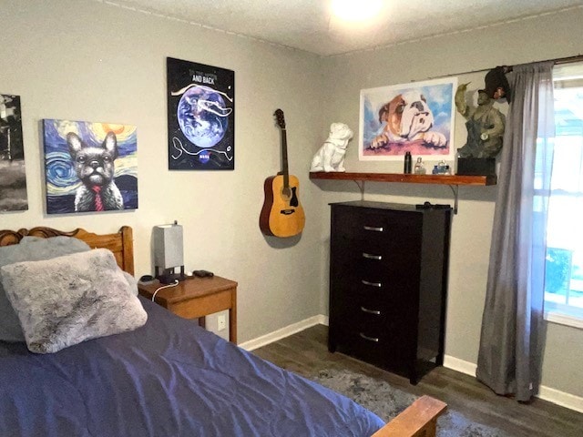 bedroom featuring dark hardwood / wood-style floors