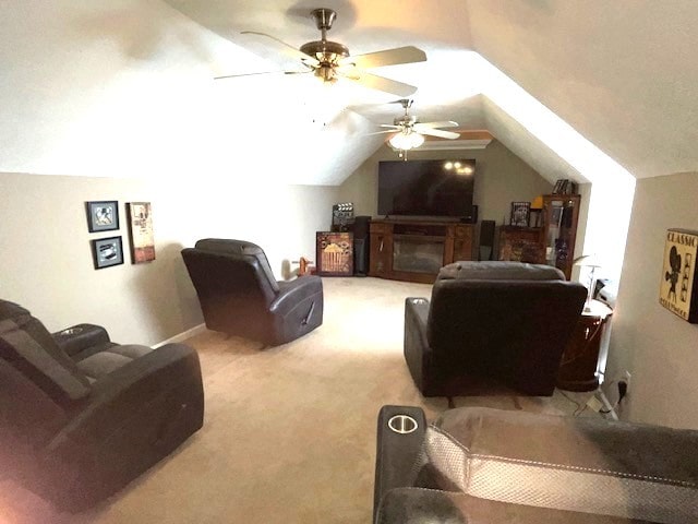 additional living space with a fireplace, ceiling fan, lofted ceiling, and carpet