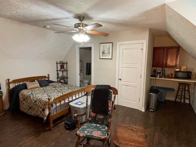 bedroom featuring a textured ceiling, ceiling fan, and dark hardwood / wood-style floors