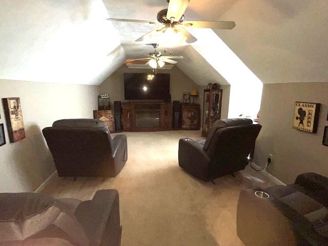 living room with light carpet, ceiling fan, and vaulted ceiling