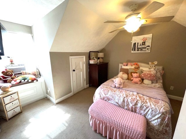 bedroom featuring lofted ceiling, ceiling fan, and carpet floors