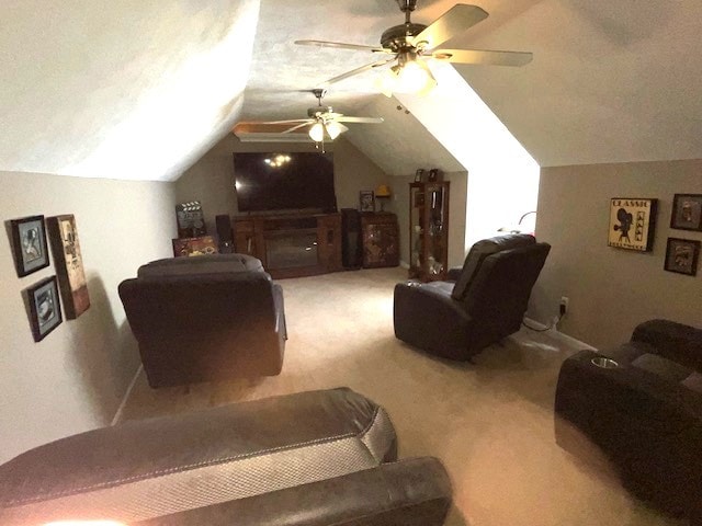 carpeted bedroom with ceiling fan and vaulted ceiling