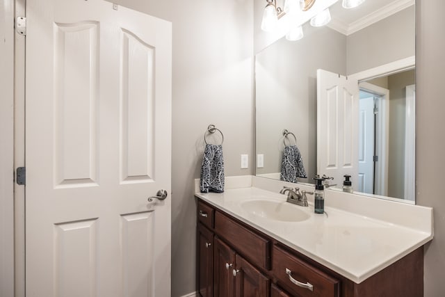 bathroom featuring vanity and crown molding