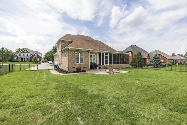 back of property with a patio, a fenced backyard, brick siding, a sunroom, and crawl space