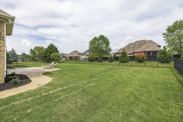 view of yard with a patio area and a fenced backyard