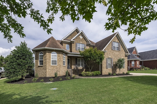 craftsman house with a front lawn