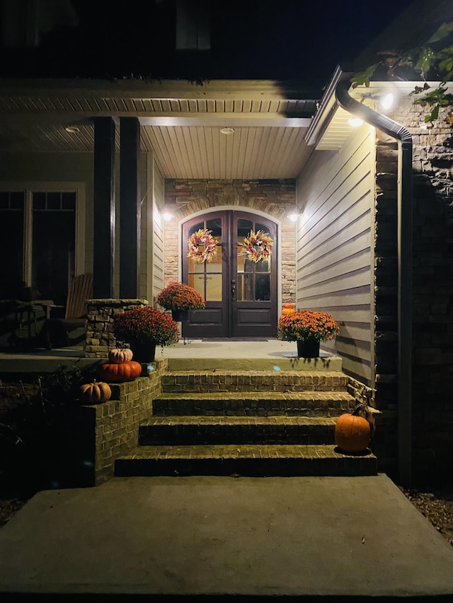 2271 Timberwood Trce, Monteagle, TN 37356 - exterior entry at twilight featuring french doors and a porch