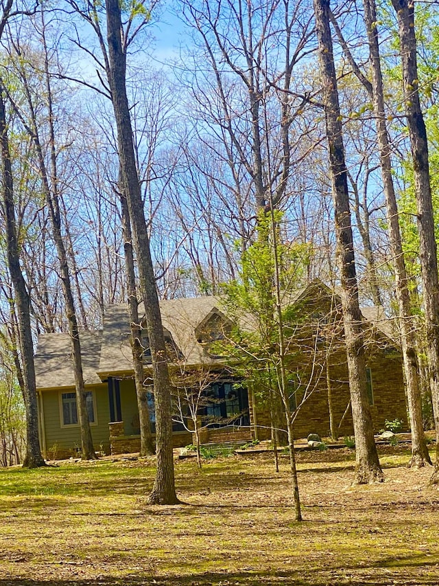2271 Timberwood Trce, Monteagle, TN 37356 - view of front of home with a shingled roof and a front lawn