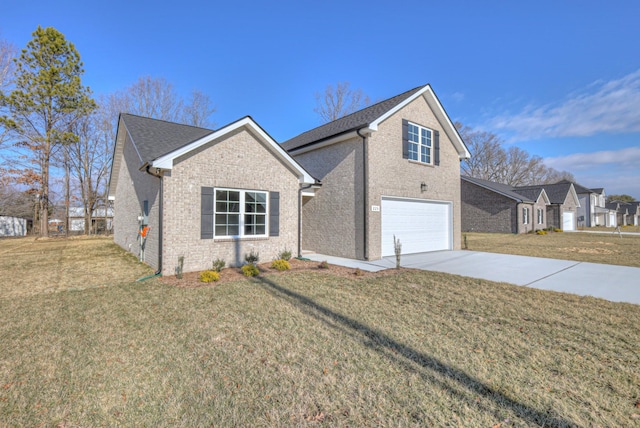 view of front of home with a garage and a front yard