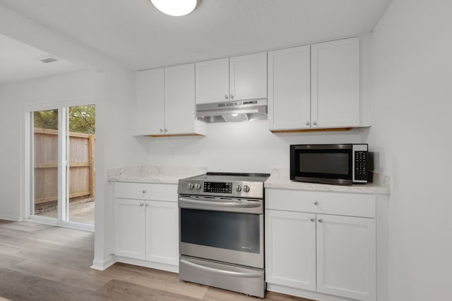 kitchen with appliances with stainless steel finishes, light wood-type flooring, and white cabinets